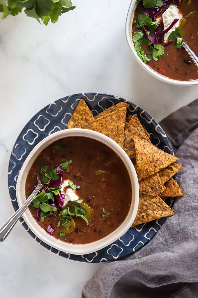 bowl of black bean soup with chips